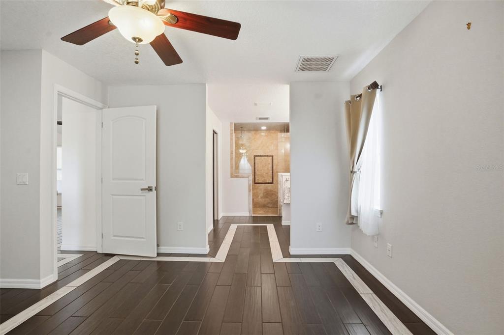 7037 County Road 625 Bushnell, FL 33513 - Photo 35 of 99 a view of empty room with wooden floor