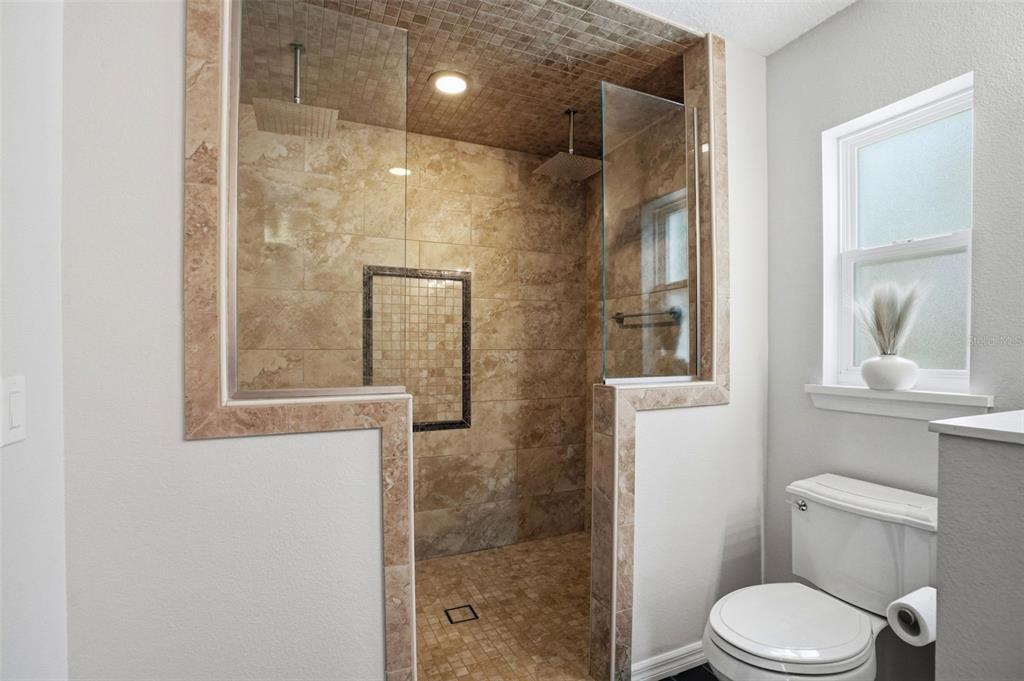 7037 County Road 625 Bushnell, FL 33513 - Photo 37 of 99 a bathroom with a toilet and a shower
