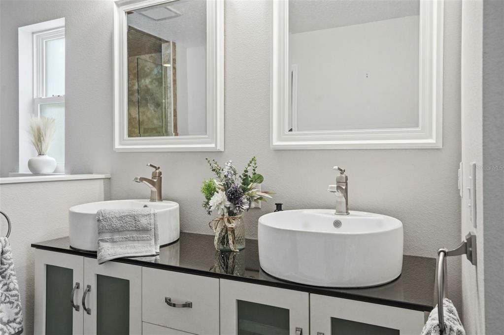 7037 County Road 625 Bushnell, FL 33513 - Photo 39 of 99 a bathroom with a sink and a window