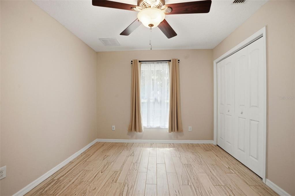 7037 County Road 625 Bushnell, FL 33513 - Photo 52 of 99 a view of empty room with wooden floor