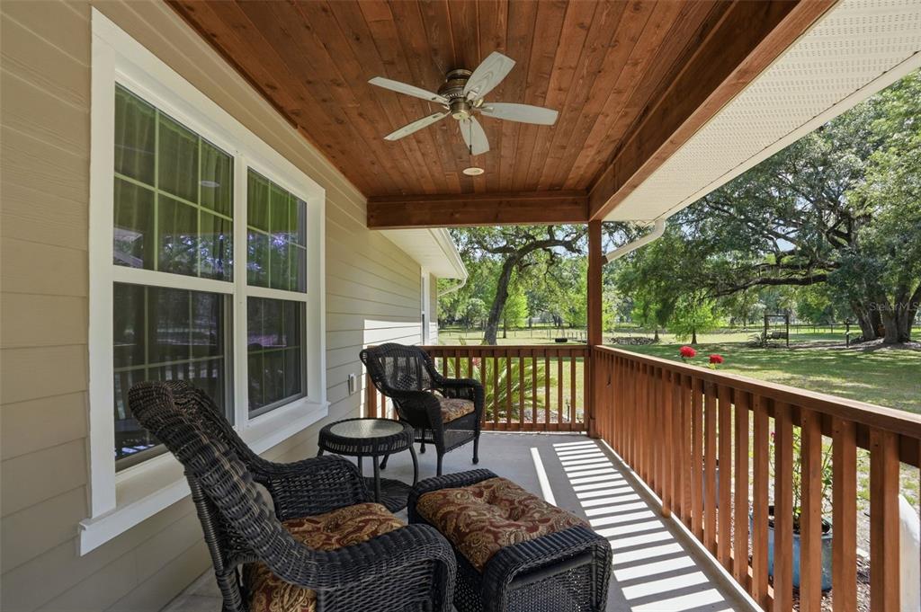 7037 County Road 625 Bushnell, FL 33513 - Photo 7 of 99 a view of a chairs and table in the balcony