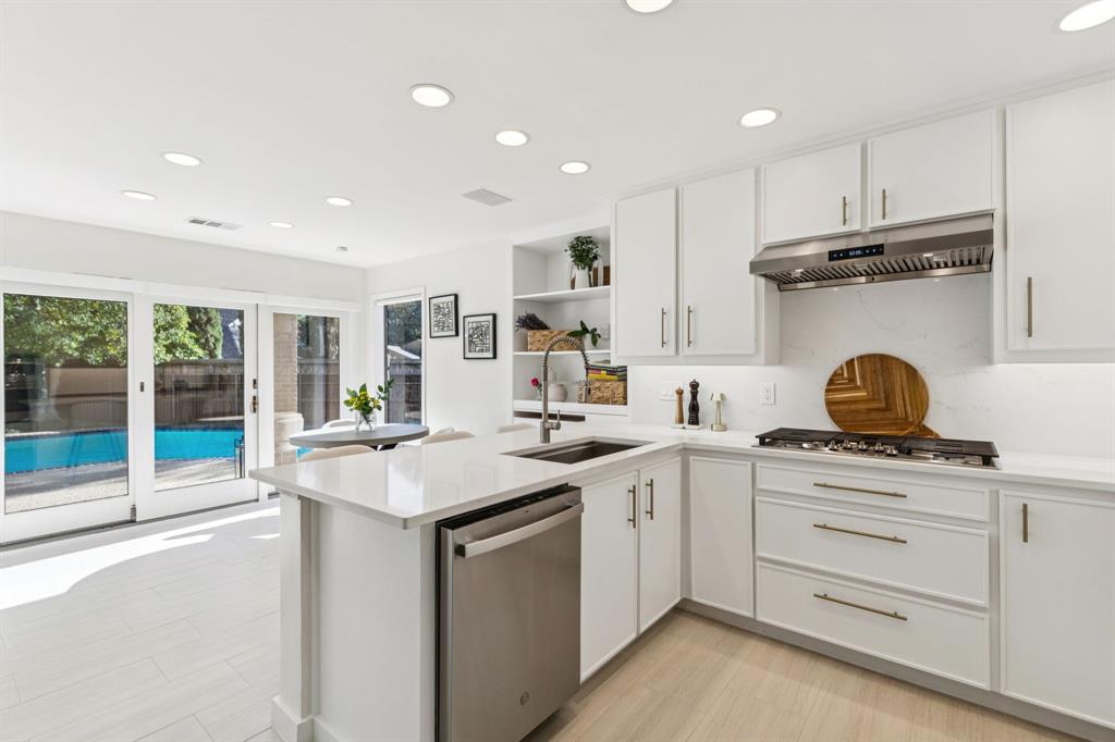 9616 Viewside Drive Dallas, TX 75231 - Photo 11 of 38 Kitchen featuring white cabinets, stainless steel appliances, recessed lighting, a peninsula, and open shelves