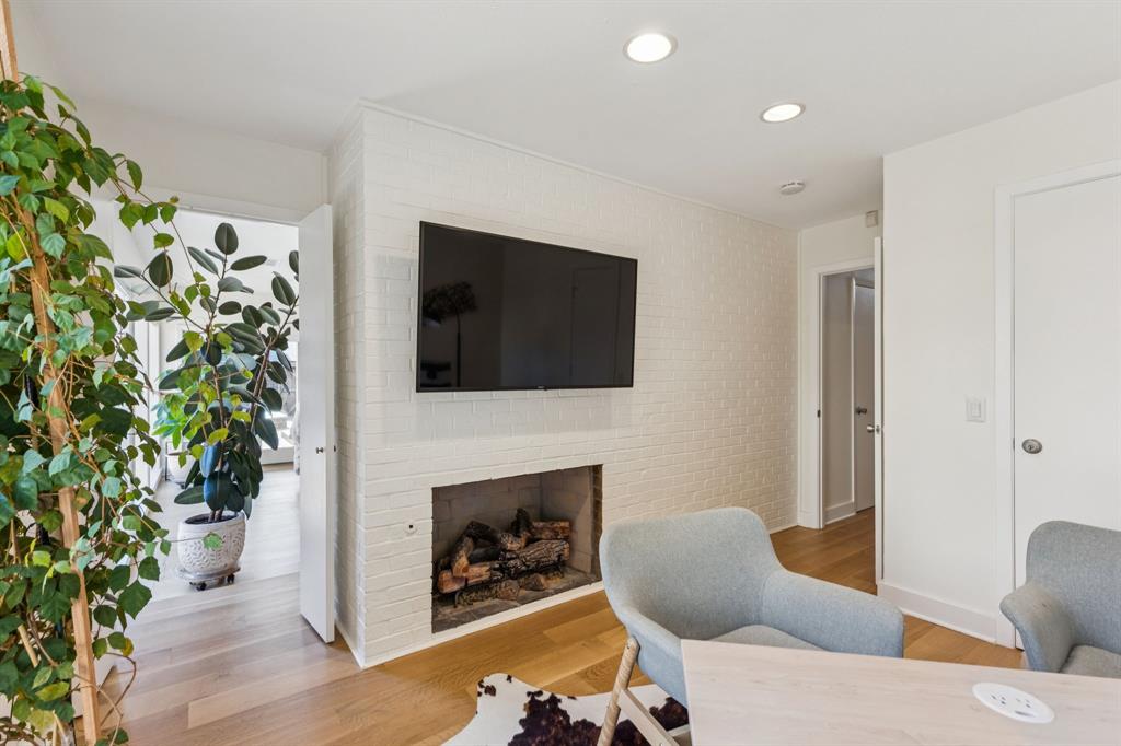 9616 Viewside Drive Dallas, TX 75231 - Photo 17 of 38 Office with a fireplace, light wood-style flooring, and recessed lighting