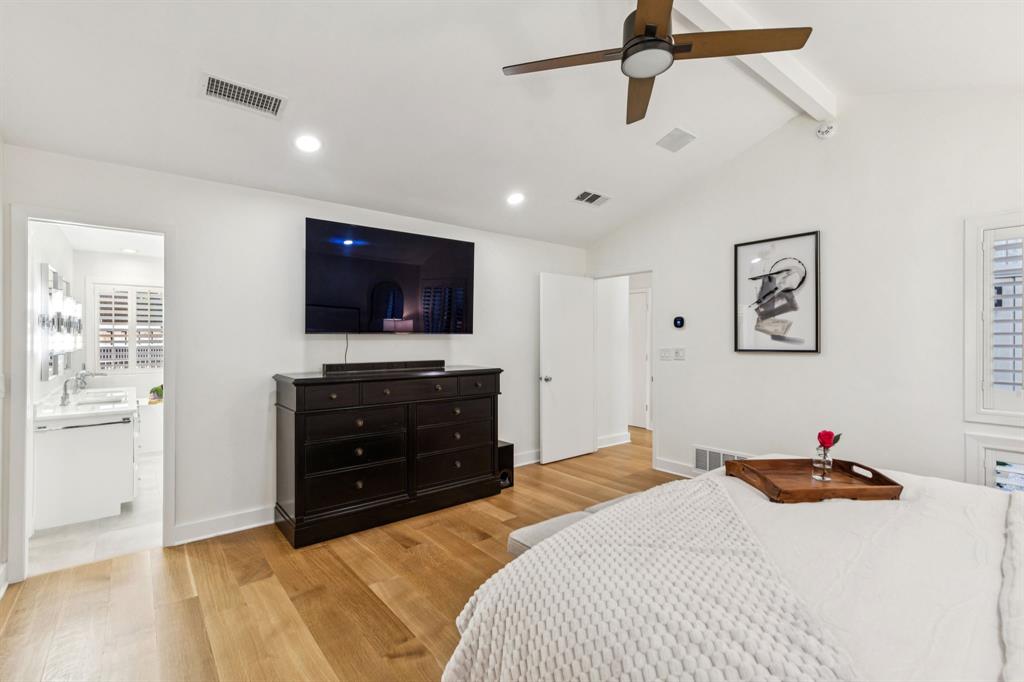 9616 Viewside Drive Dallas, TX 75231 - Photo 19 of 38 Bedroom featuring light wood-style floors and ceiling fan