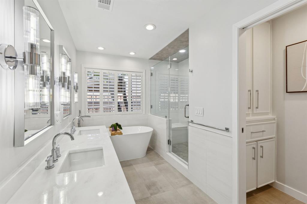 9616 Viewside Drive Dallas, TX 75231 - Photo 21 of 38 Full bath featuring double vanity, a stall shower, a soaking tub, and recessed lighting