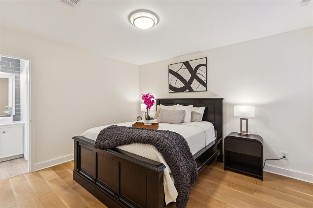 9616 Viewside Drive Dallas, TX 75231 - Photo 22 of 38 Bedroom featuring light wood finished floors