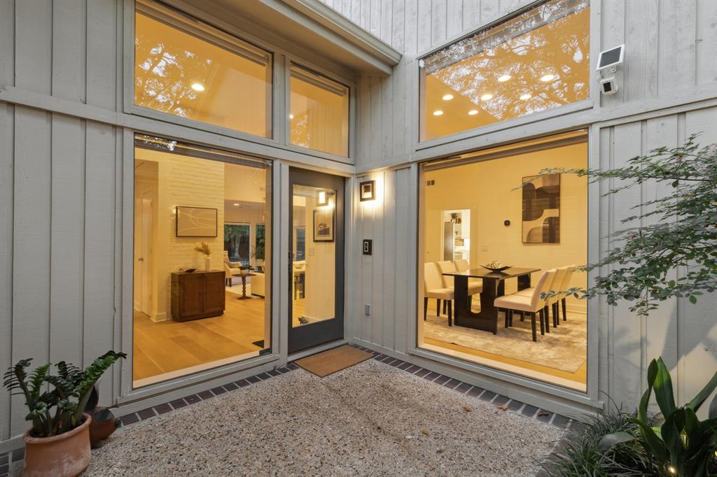 9616 Viewside Drive Dallas, TX 75231 - Photo 3 of 38 Property entrance with board and batten siding