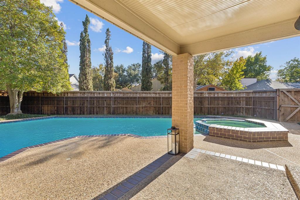 9616 Viewside Drive Dallas, TX 75231 - Photo 31 of 38 View of pool featuring a patio, a fenced backyard, and a pool with connected hot tub