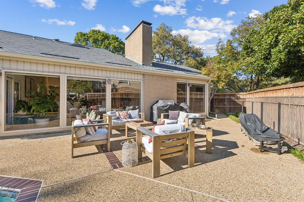 9616 Viewside Drive Dallas, TX 75231 - Photo 32 of 38 Rear view of house featuring a fenced backyard, pool spa,an outdoor hangout area, a shingled roof, a patio, and a chimney