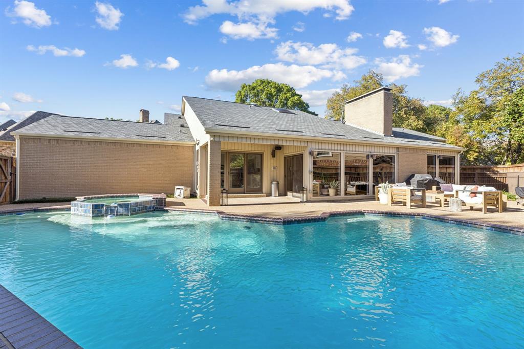 9616 Viewside Drive Dallas, TX 75231 - Photo 33 of 38 View of pool with a patio area, a pool with connected hot tub, an outdoor living space, and area for grilling