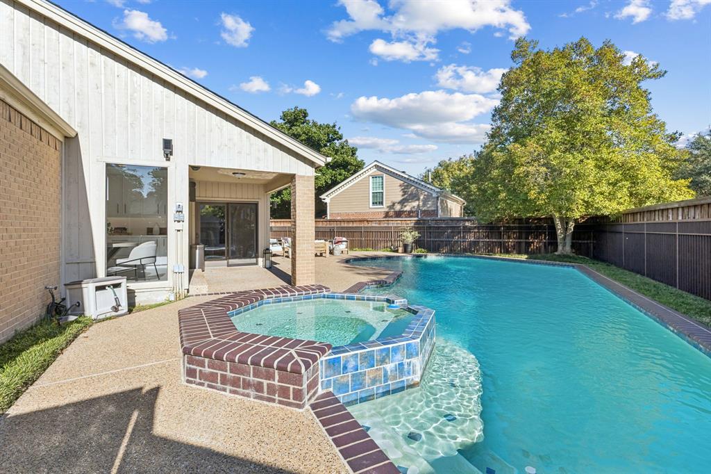 9616 Viewside Drive Dallas, TX 75231 - Photo 36 of 38 View of pool featuring a pool with connected hot tub, a fenced backyard, and a patio area