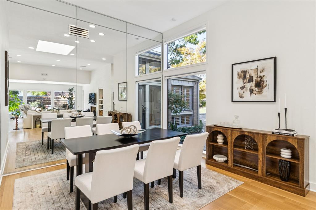 9616 Viewside Drive Dallas, TX 75231 - Photo 7 of 38 Dining area with a skylight, a towering ceiling, light wood-type flooring, and recessed lighting