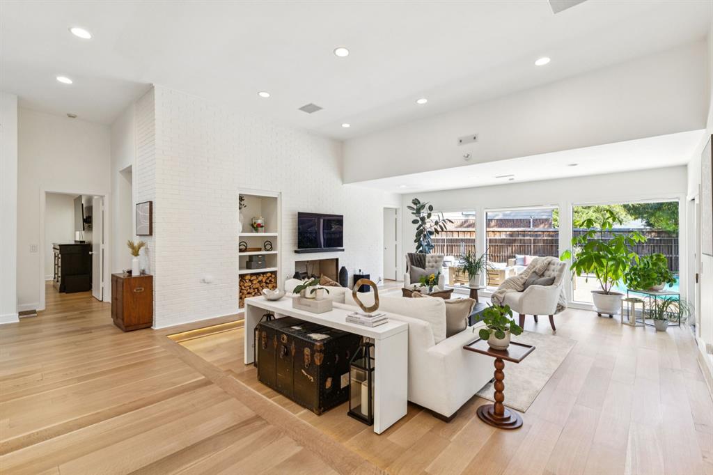 9616 Viewside Drive Dallas, TX 75231 - Photo 10 of 38 Living room featuring light wood-type flooring, recessed lighting, and built in shelves
