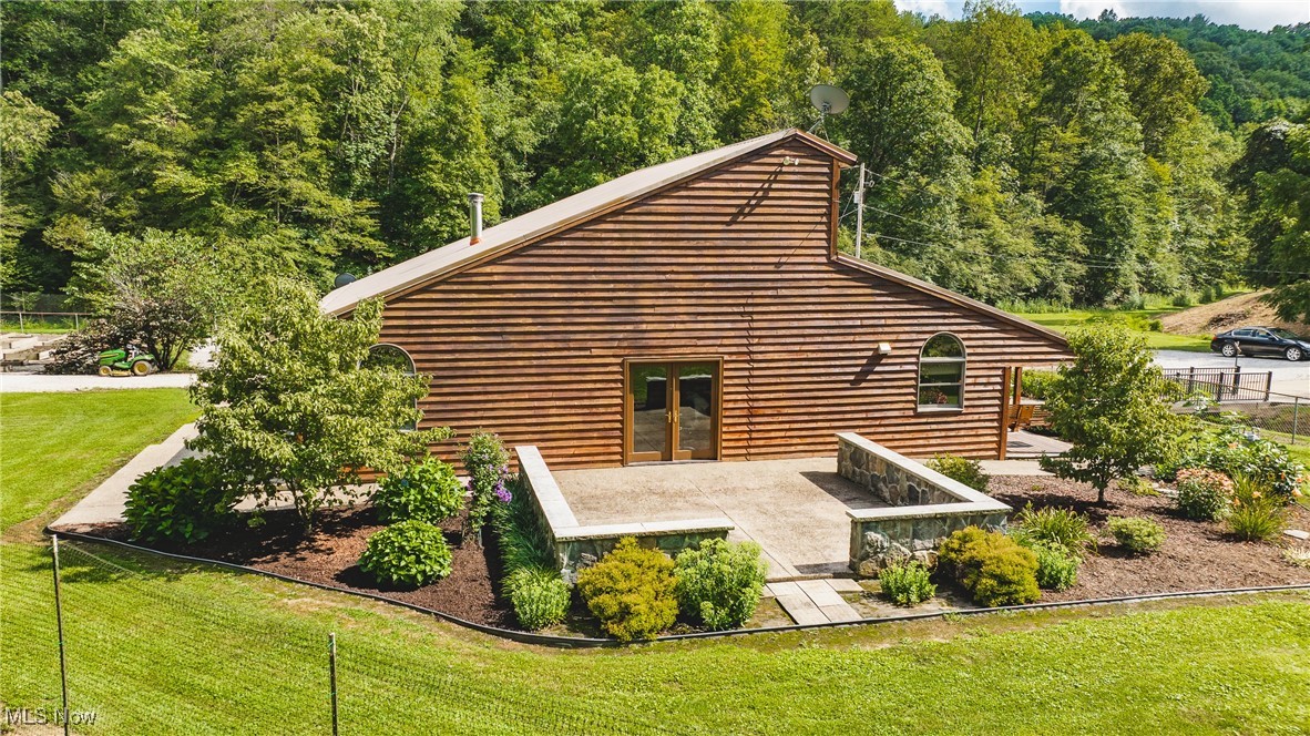 8089 Elk Fork Road Middlebourne, WV 26149 - Photo 47 of 50 Side View, French Doors From Office, Large Patio with Knee Wall