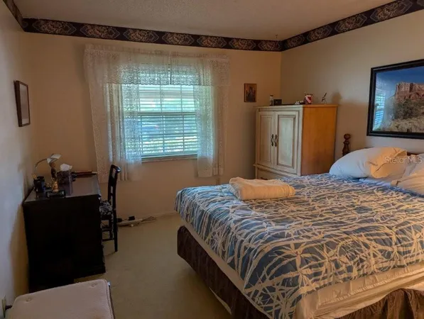 a view of a bedroom from the hallway