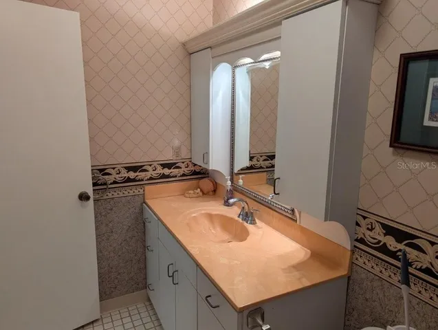 a kitchen with a refrigerator and a stove