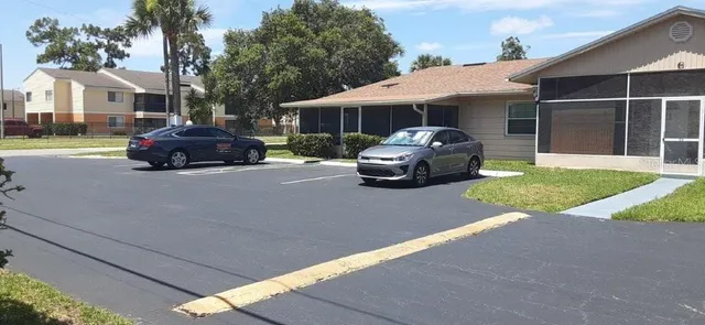 a front view of a house with a yard and porch