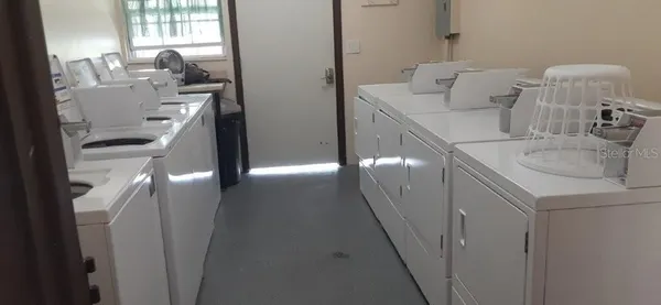 a patio with a table and chairs