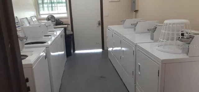 a patio with a table and chairs