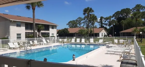 a view of a swimming pool with a patio