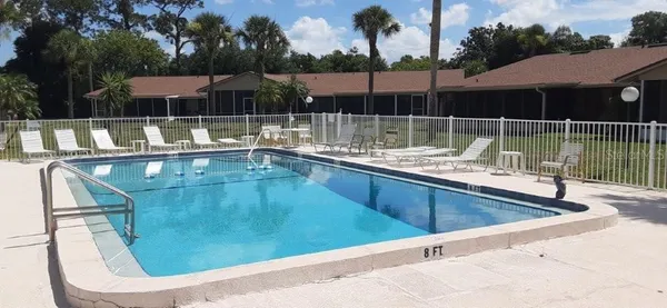 a view of a house with backyard