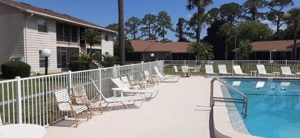 a view of a house with backyard and garden