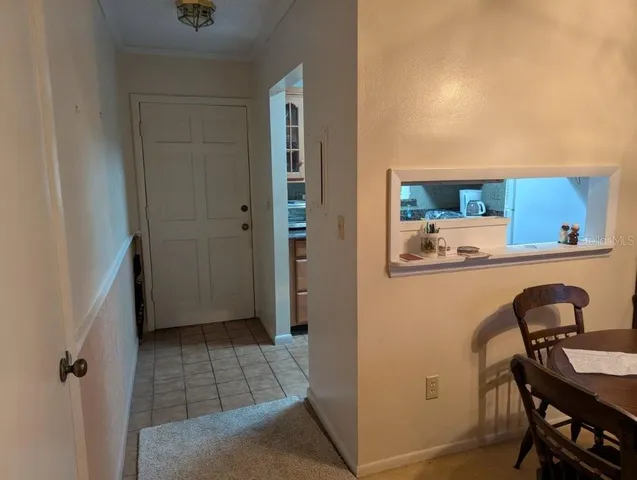 a room with a table and chairs