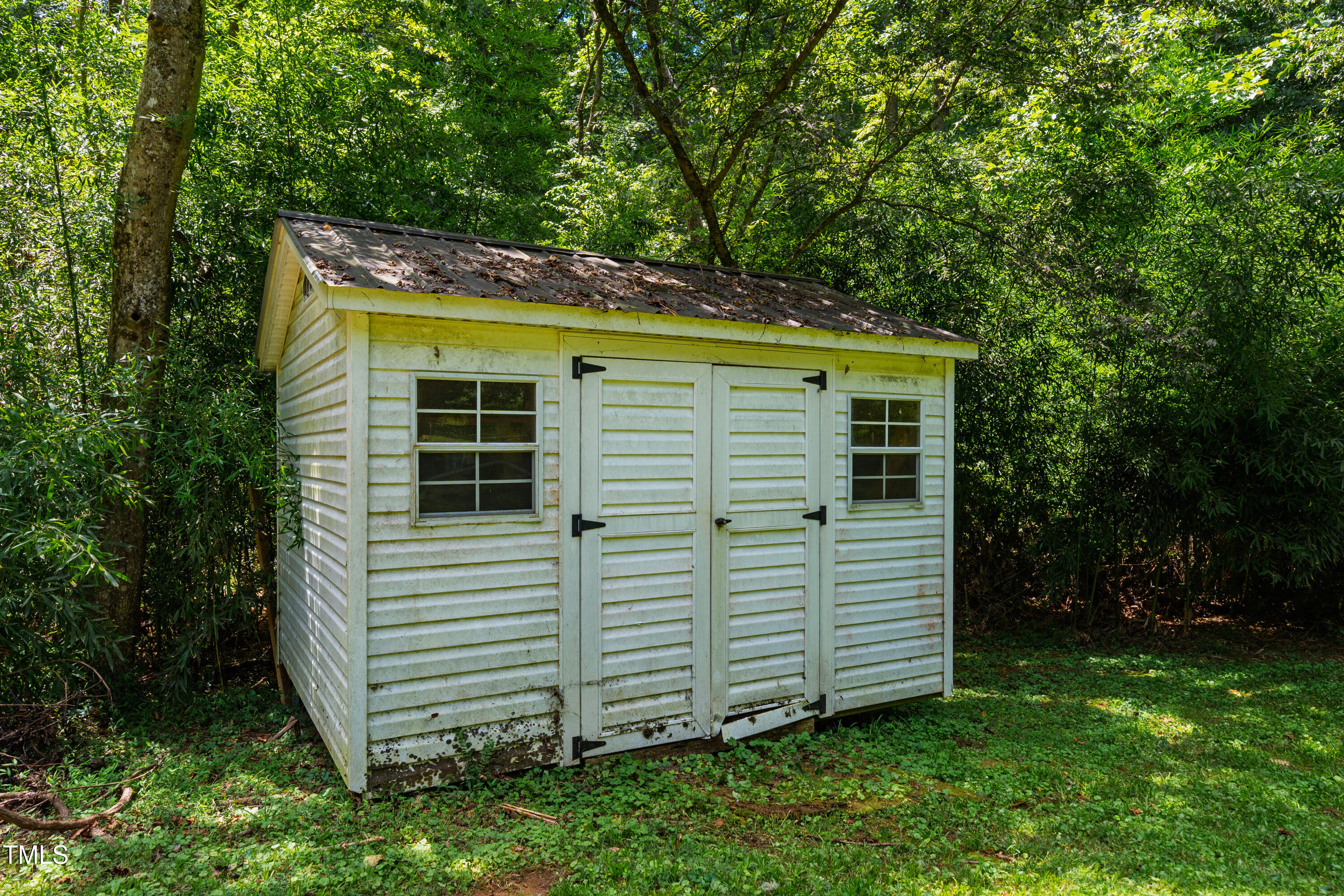 10 Bynum Beach Road Pittsboro, NC 27312 - Photo 30 of 41 a view of a house with a yard