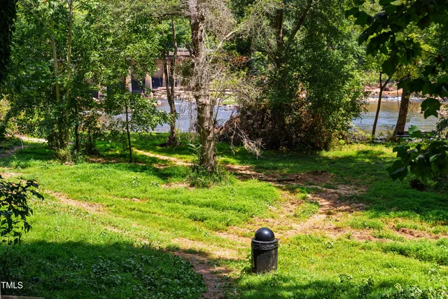a view of a swimming pool with an outdoor seating