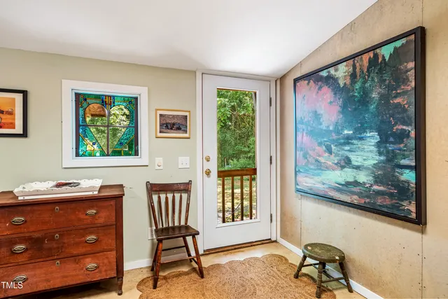 a bedroom with furniture and a window