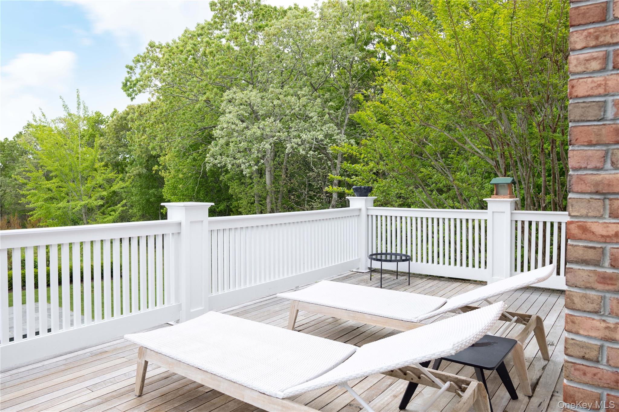 486 Middle Line Highway Bridgehampton, NY 11976 - Photo 14 of 25 a balcony with wooden floor and fence