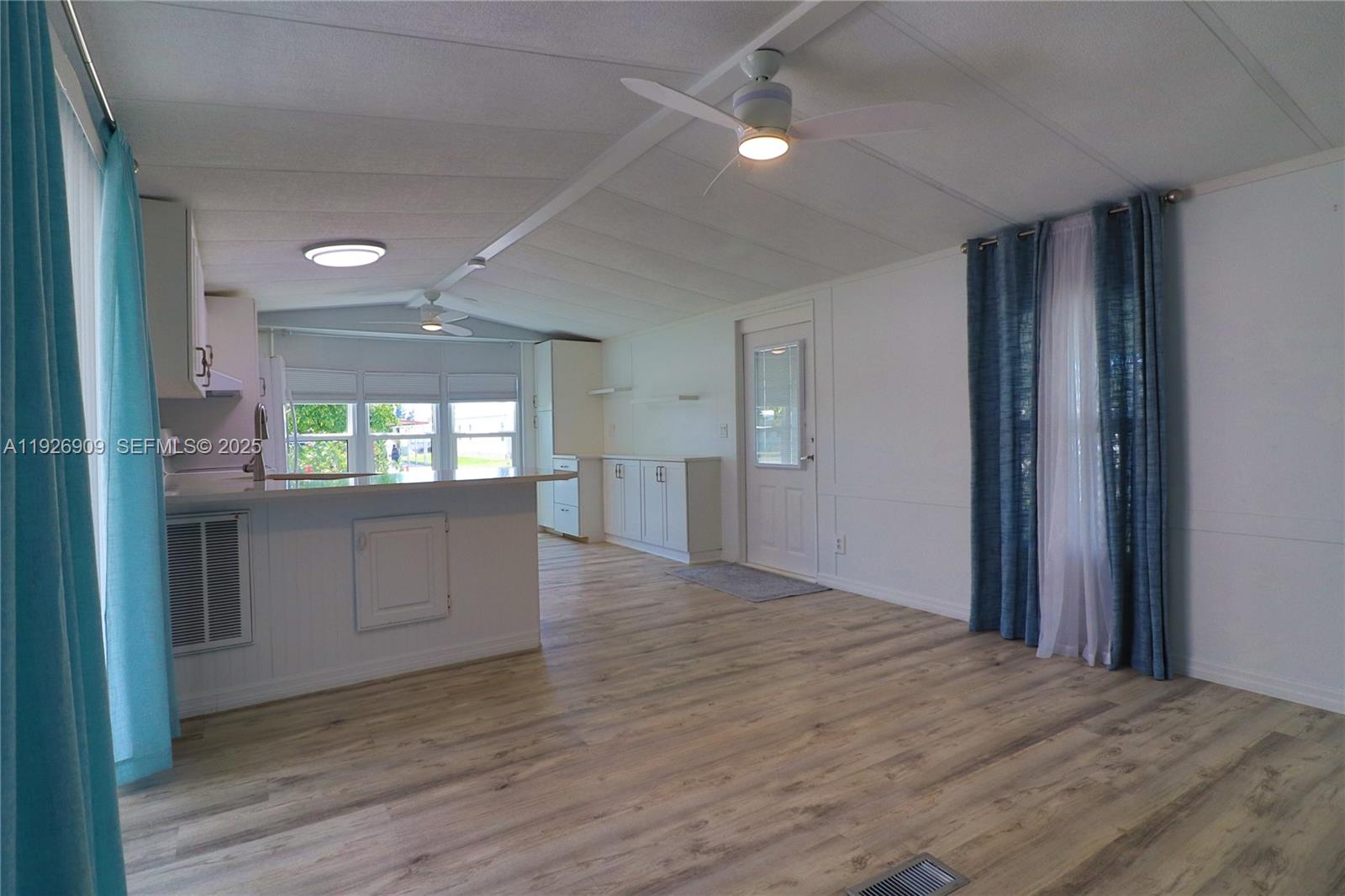 221 Grassy Key Lane Naples, FL 34114 - Photo 15 of 44 a view of an empty room and window