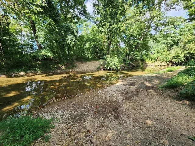 an aerial view of a residential houses with outdoor space