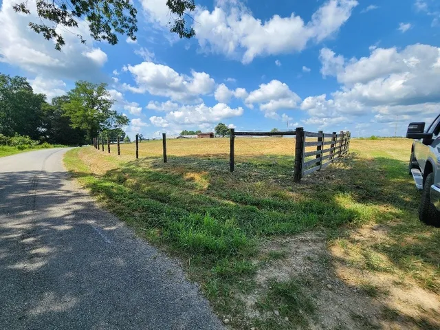 a view of a field with an trees