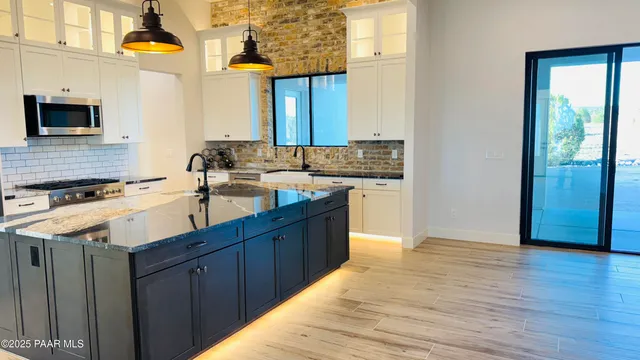 a kitchen with wooden cabinets and a sink