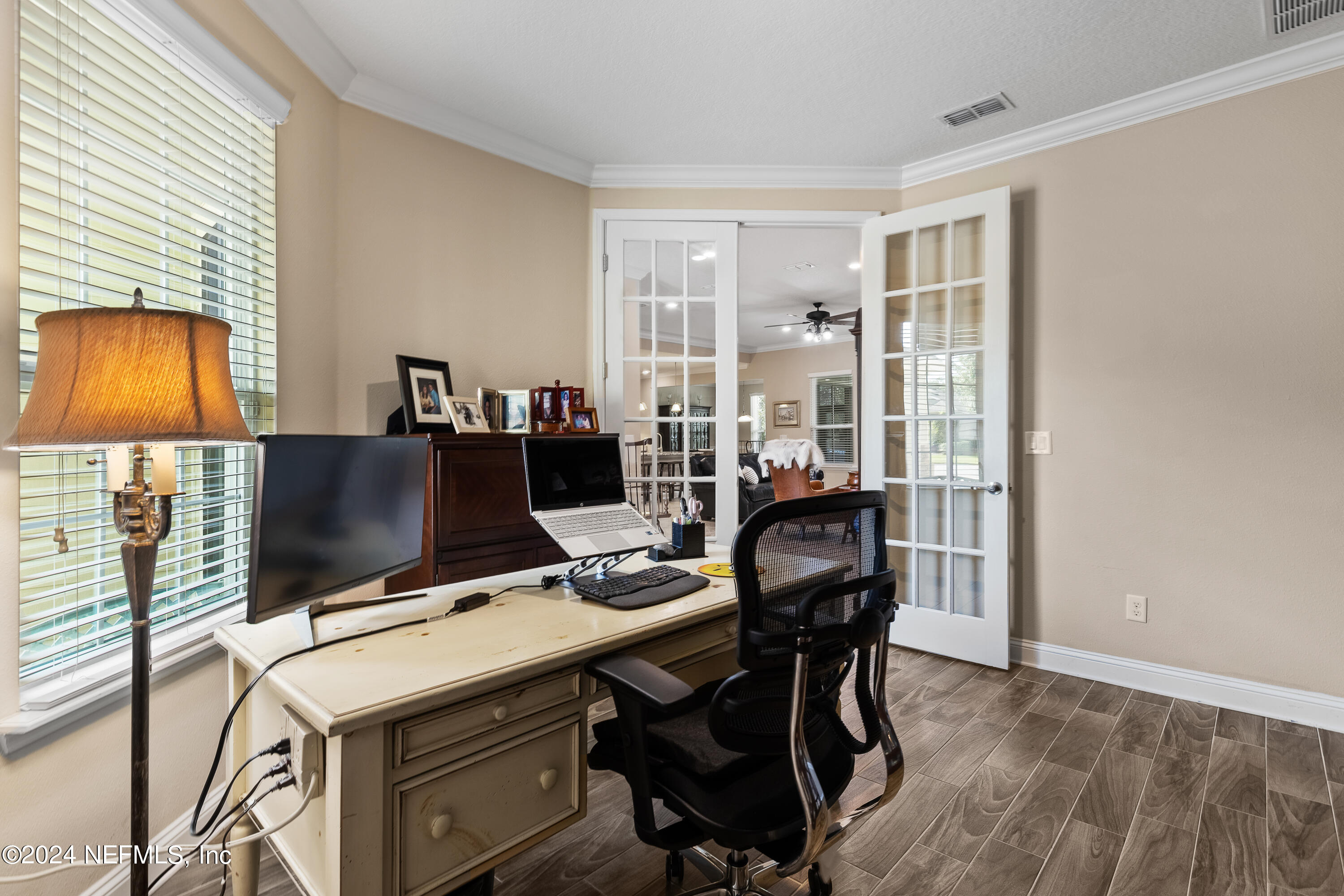 405 St Kitts Loop St. Augustine, FL 32092 - Photo 11 of 65 a view of a workspace with furniture and a window