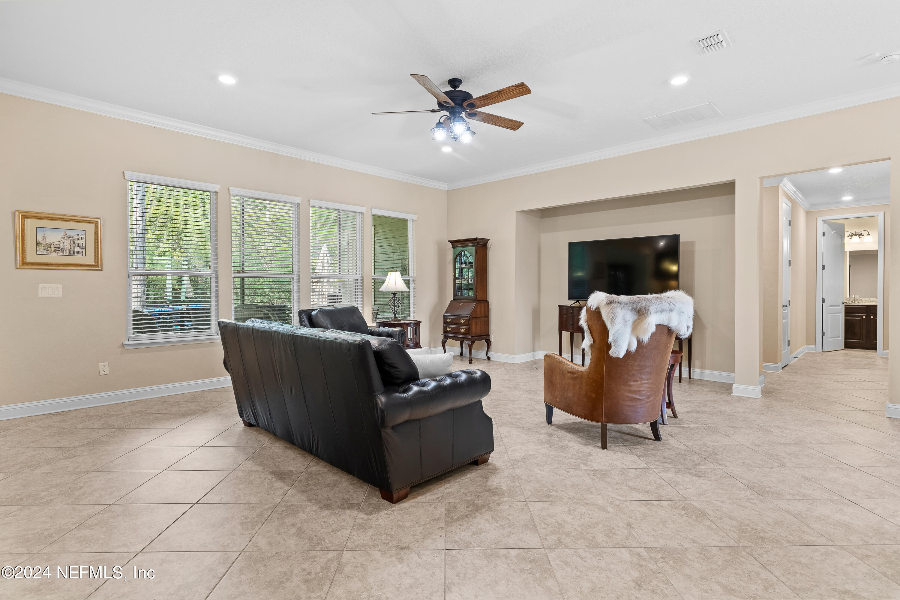 405 St Kitts Loop St. Augustine, FL 32092 - Photo 15 of 65 a living room with furniture and a large window