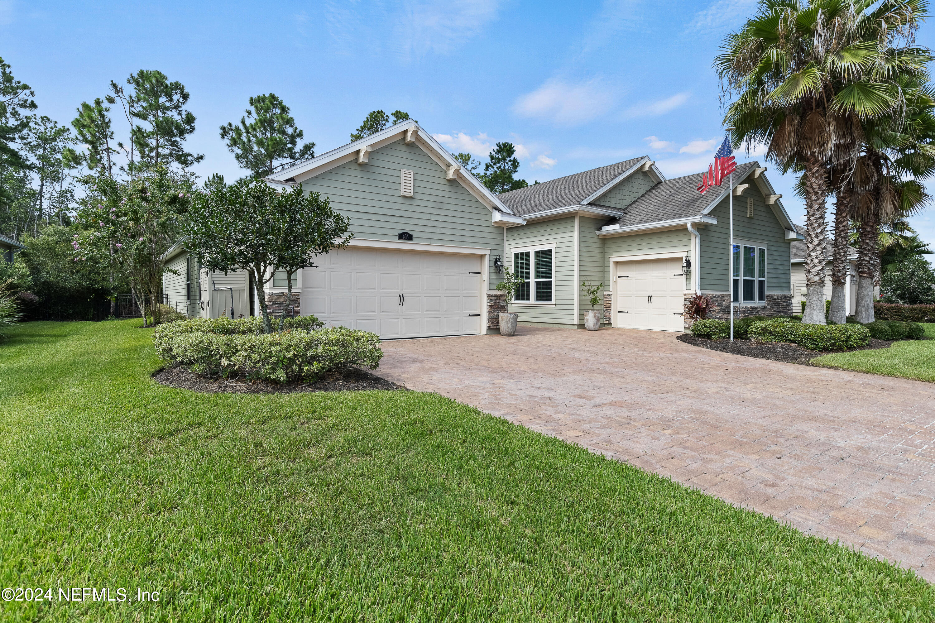 405 St Kitts Loop St. Augustine, FL 32092 - Photo 3 of 65 a front view of a house with a yard and garage