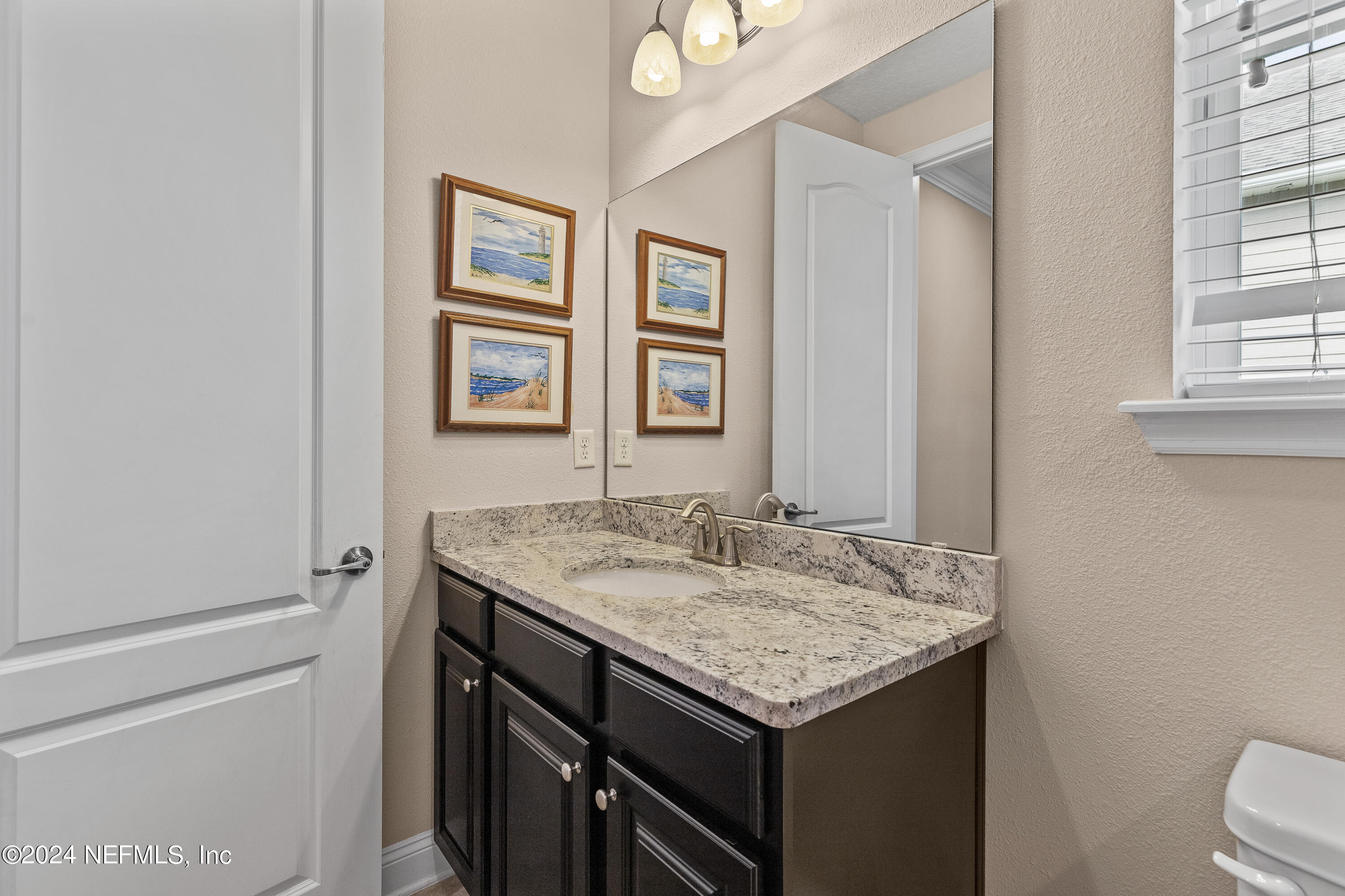 405 St Kitts Loop St. Augustine, FL 32092 - Photo 36 of 65 a bathroom with a granite countertop sink and a mirror
