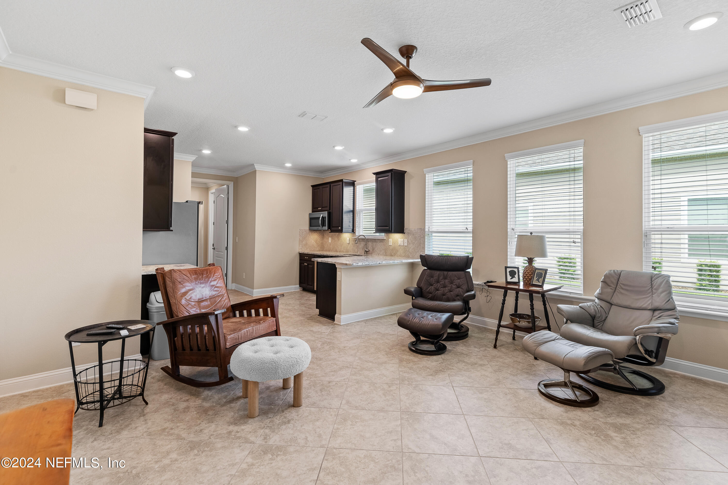 405 St Kitts Loop St. Augustine, FL 32092 - Photo 43 of 65 a living room with furniture and a large window