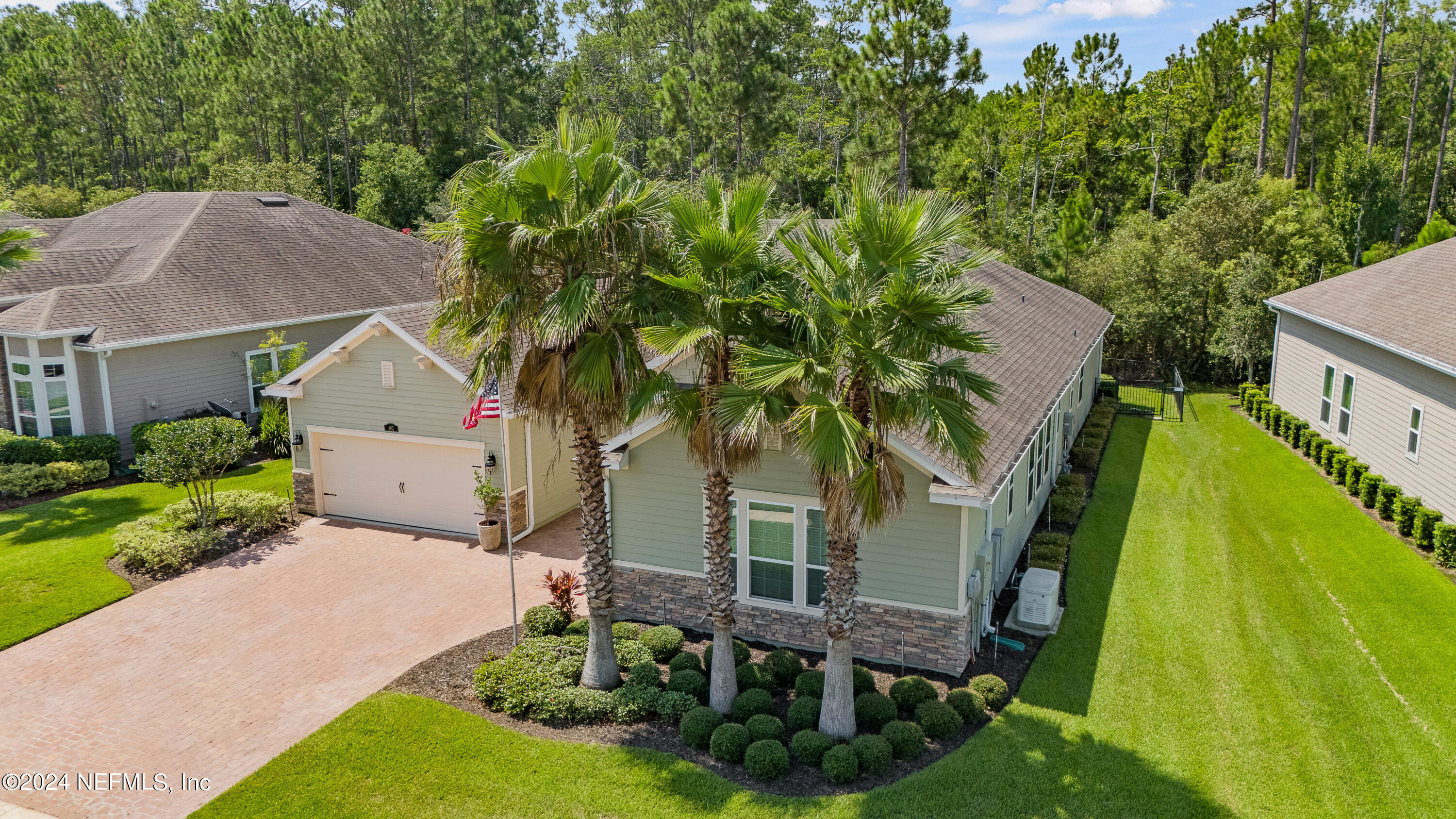 405 St Kitts Loop St. Augustine, FL 32092 - Photo 59 of 65 a view of house with backyard and trees