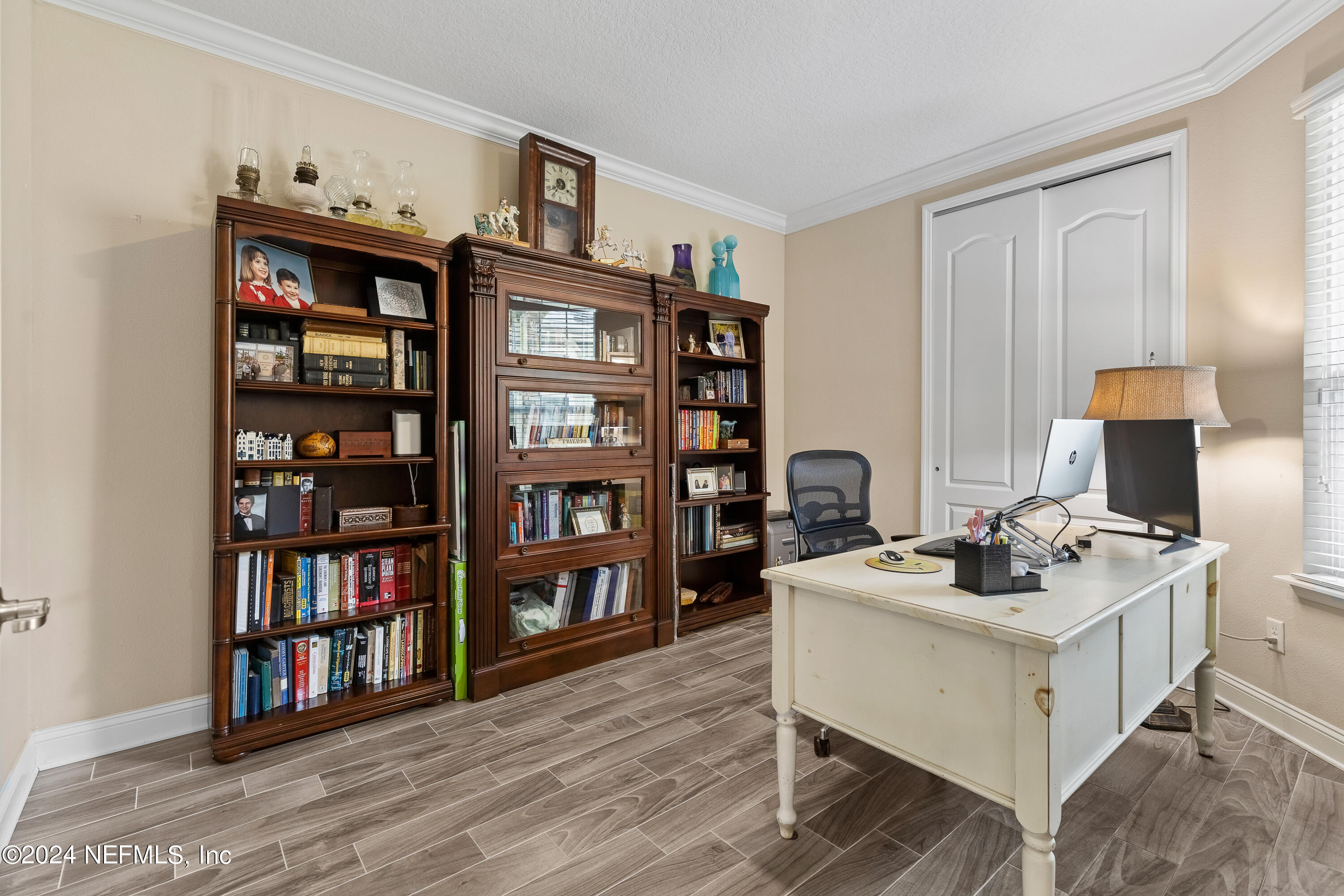 405 St Kitts Loop St. Augustine, FL 32092 - Photo 10 of 65 a white stove sitting next to a book shelf