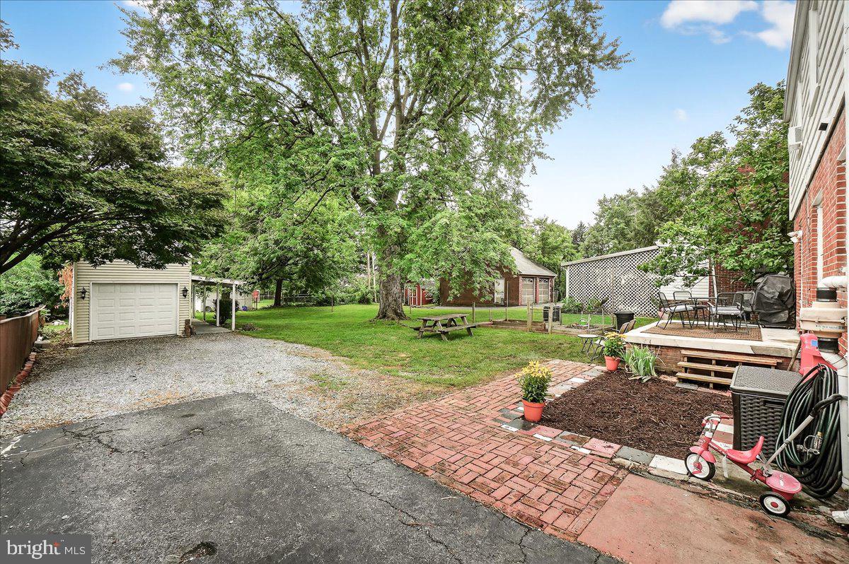22 Norva Avenue Frederick, MD 21701 - Photo 22 of 37 a view of a house with backyard and a tree