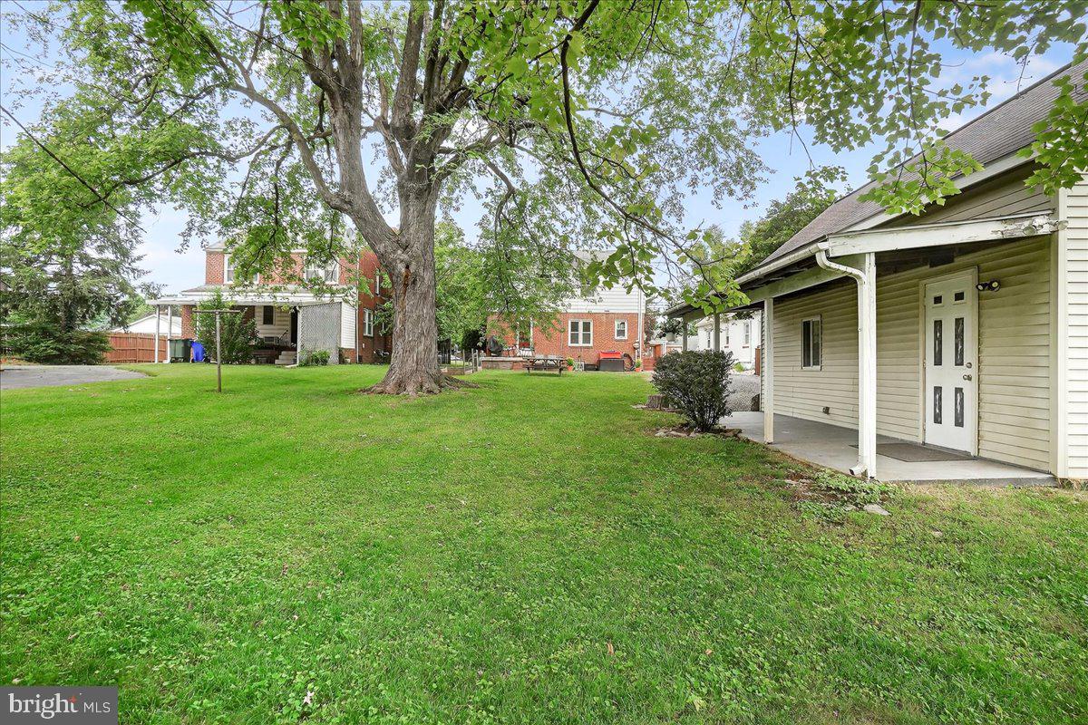 22 Norva Avenue Frederick, MD 21701 - Photo 26 of 37 a view of a yard in front of a house with large tree