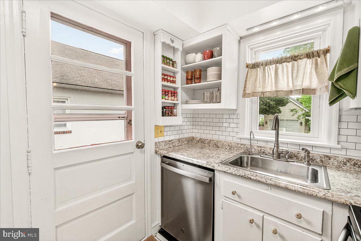 22 Norva Avenue Frederick, MD 21701 - Photo 9 of 37 a kitchen with granite countertop cabinets and window