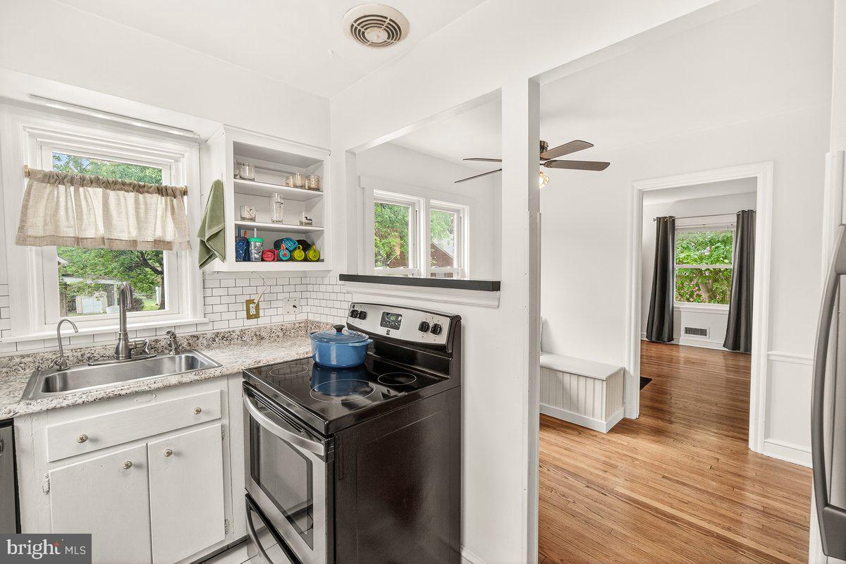 22 Norva Avenue Frederick, MD 21701 - Photo 10 of 37 a kitchen with a stove a sink and a window