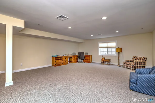 a living room with furniture and window