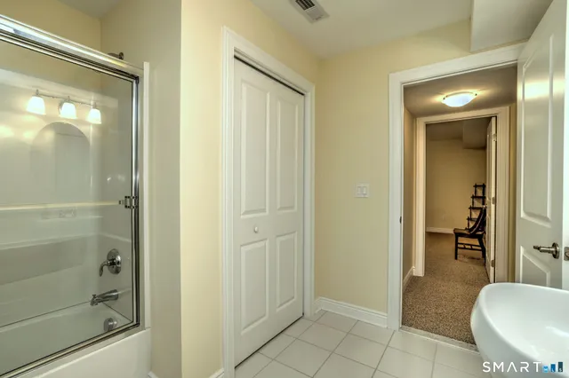 a bathroom with a shower and toilet