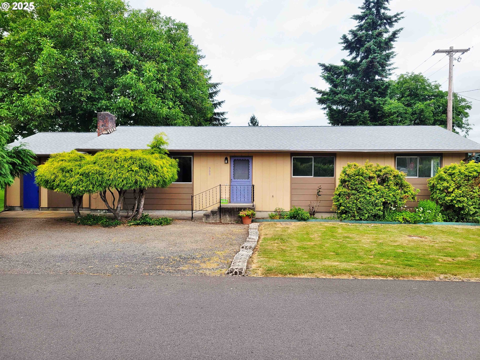 300 Maple Street Toledo, WA 98591 - Photo 17 of 19 a front view of a house with a yard and garage