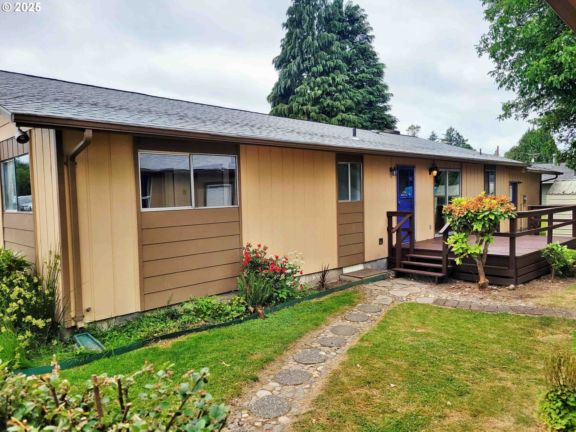 300 Maple Street Toledo, WA 98591 - Photo 18 of 19 a view of a backyard with plants and a patio